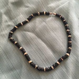 Black and white puka shell necklace.